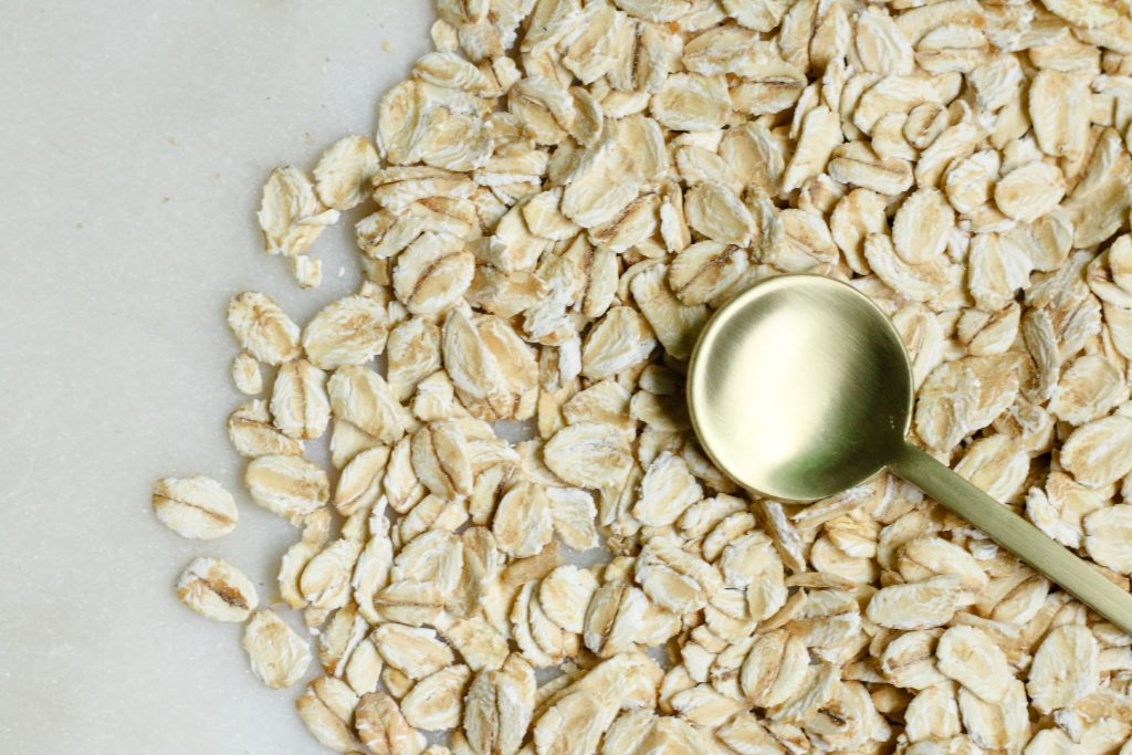 Oats on a table with a Spoon