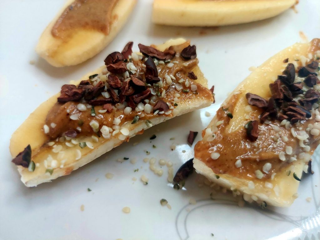 Banana slices with nut butter and hemp hearts